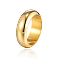 Glossy electroplated titanium steel ring in gold, black and steel colours showing metallic finish