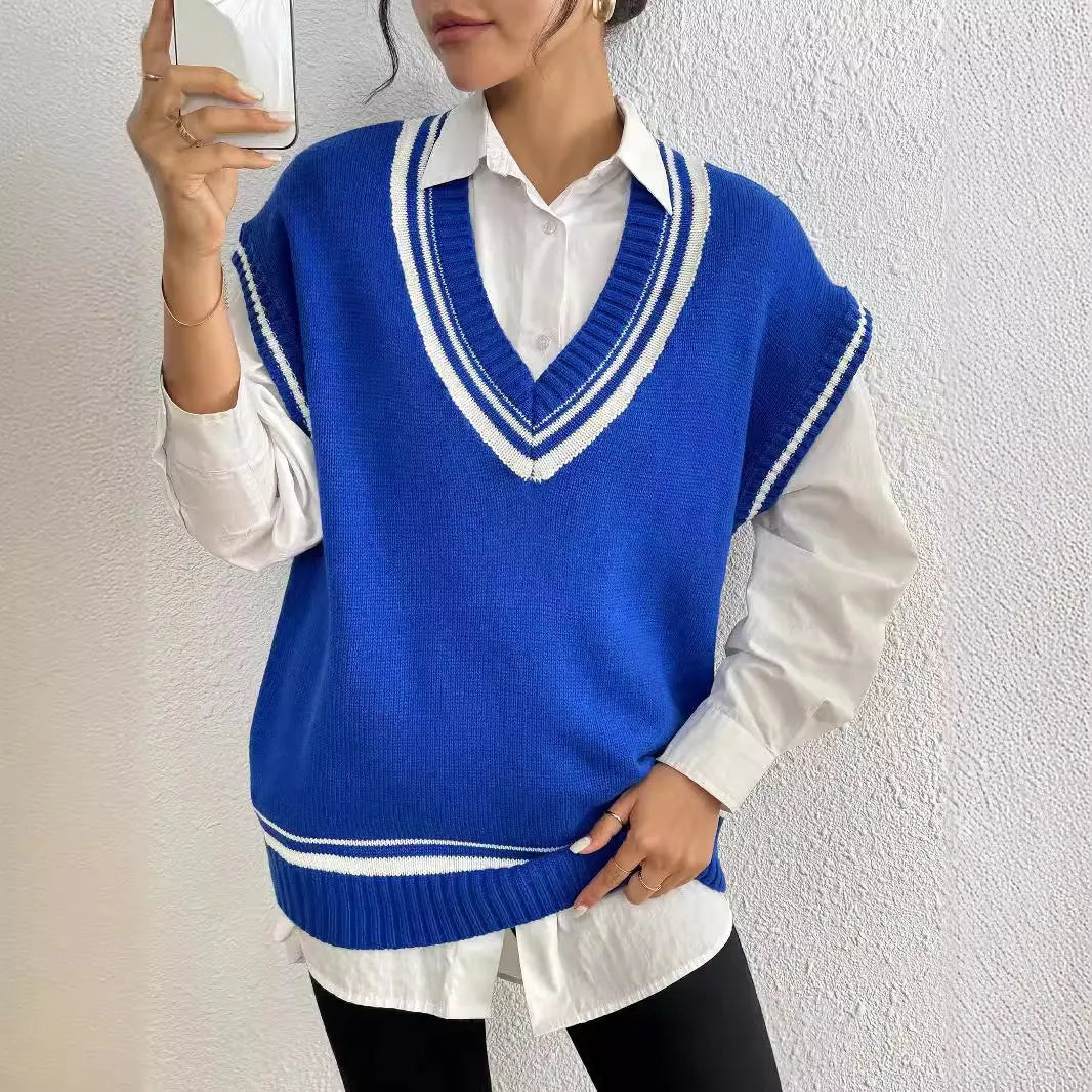 Women's loose blue college-style wool vest sweater, acrylic polyester blend, front view.
