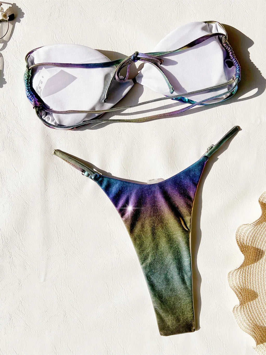 Women's gradient purple bikini swimsuit on a mannequin, showing the two-piece design.