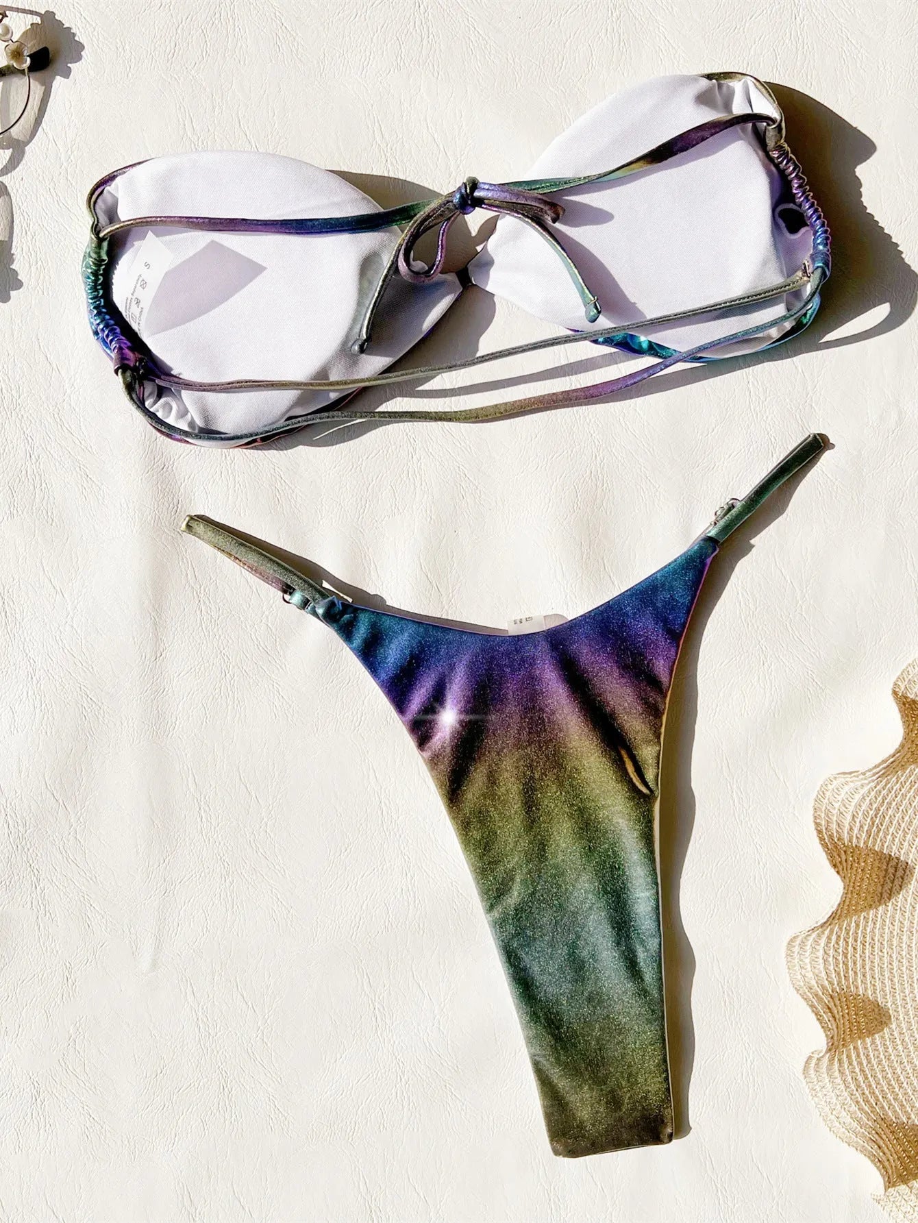 Women's gradient purple bikini swimsuit on a mannequin, showing the two-piece design.
