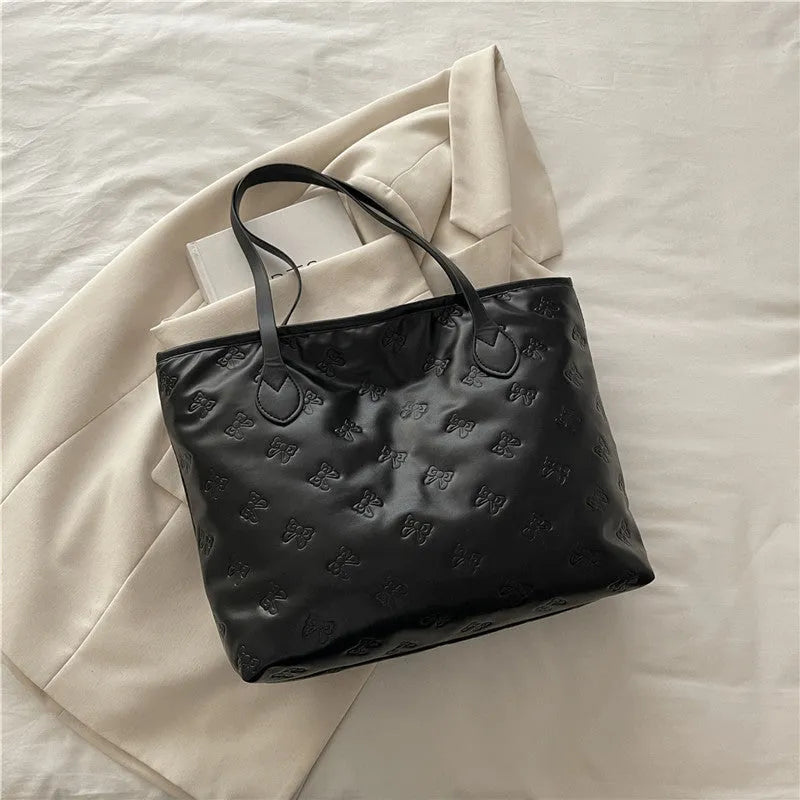 French retro simple embossed PU shoulder bag in black horizontal square shape with double shoulder straps and sewing line detail