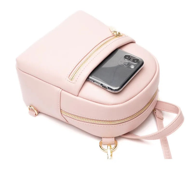 Soft PU mini backpack in street trend style with contrast colour detailing and external pocket.