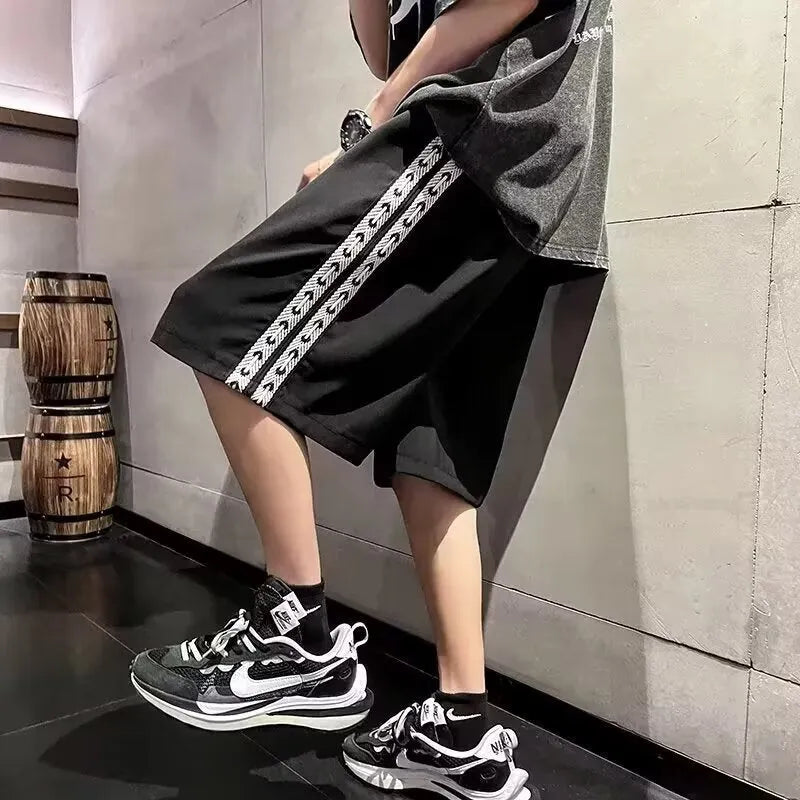 Men's loose fit baggy track pants in black, light grey, and dark grey colours with micro elastic fabric