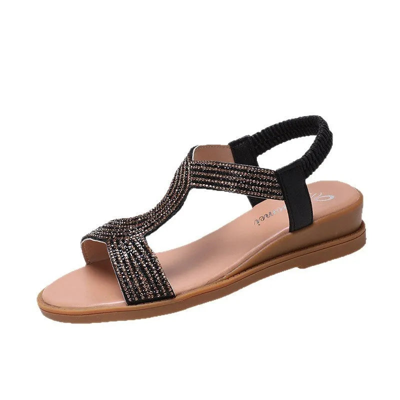 Women's glossy patent leather beach sandals with rhinestone detail on the strap.