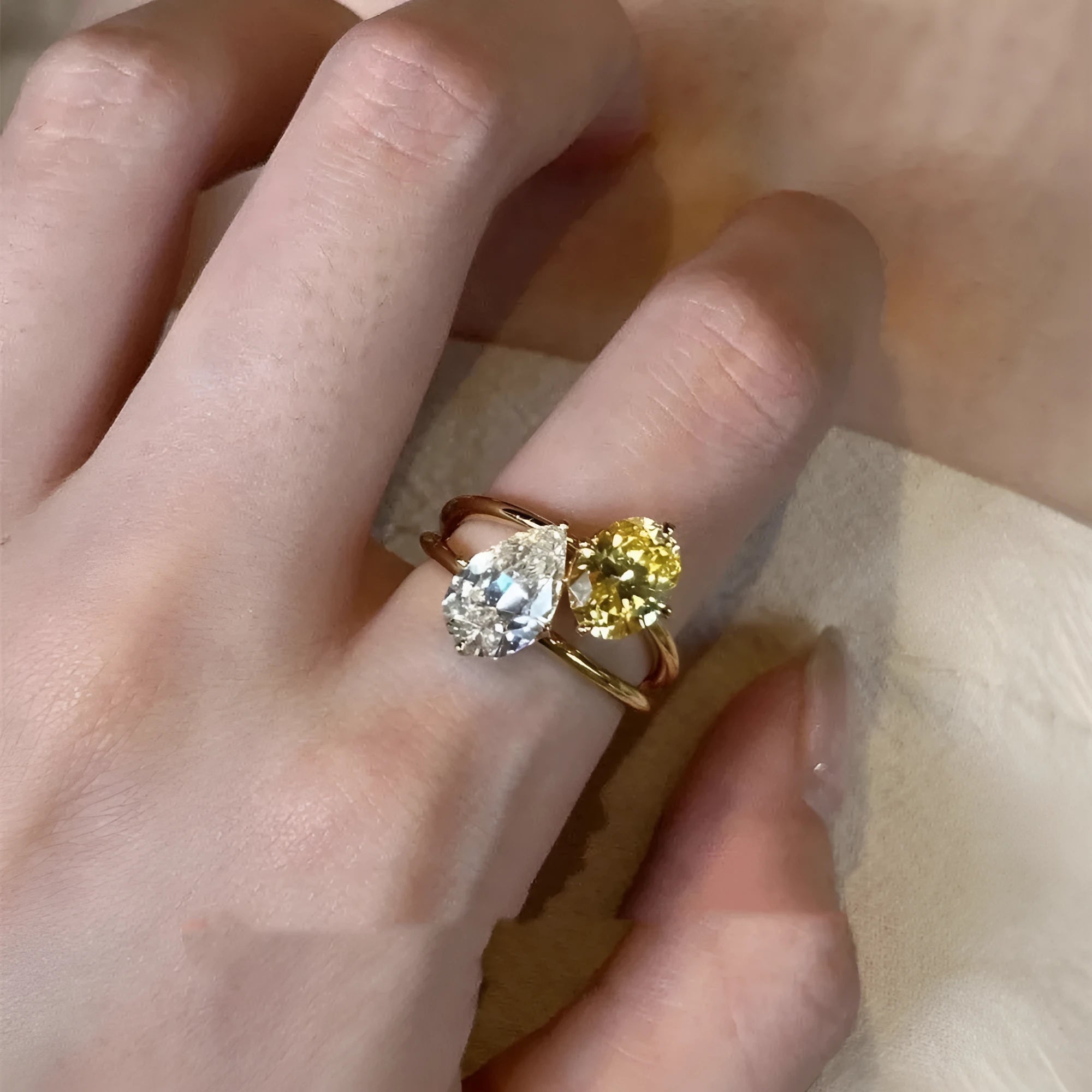 Women's copper geometric open ring with a water drop double sheng stone in a contrast colour.