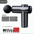 Konka V19 grey massage gun with multiple silicone attachment heads on a table.