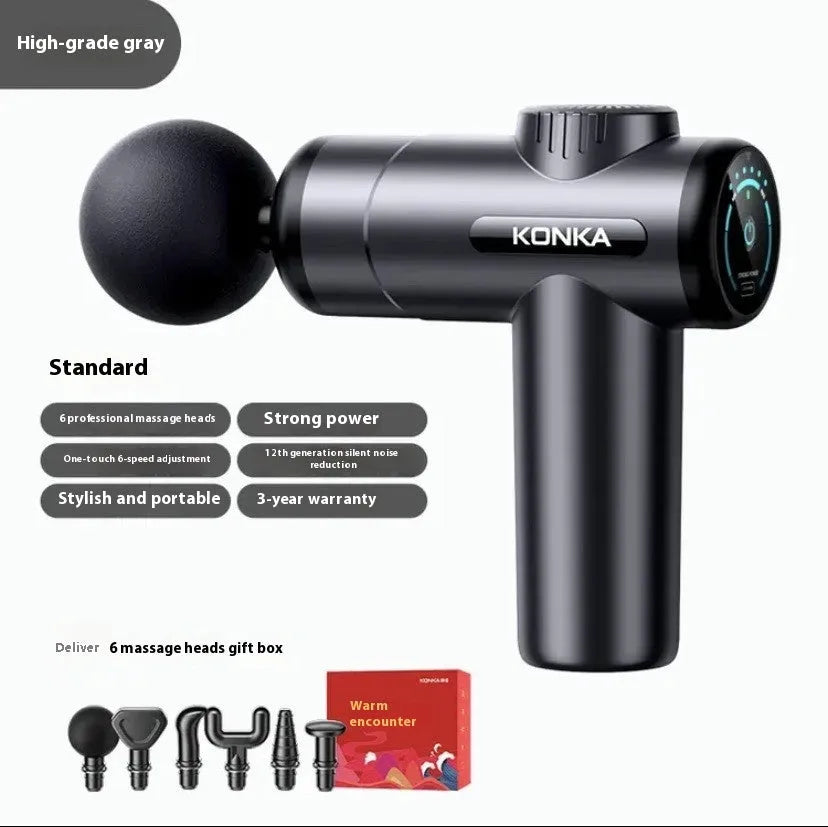 Konka V19 grey massage gun with multiple silicone attachment heads on a table.