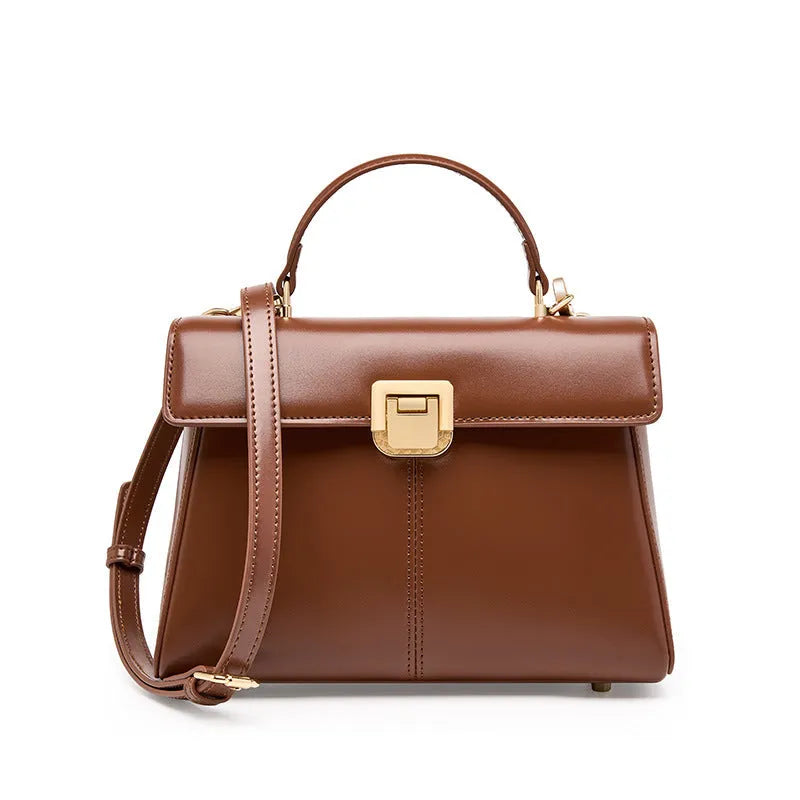 Genuine leather women's clasp shoulder bag in black, showing horizontal square shape and strap.