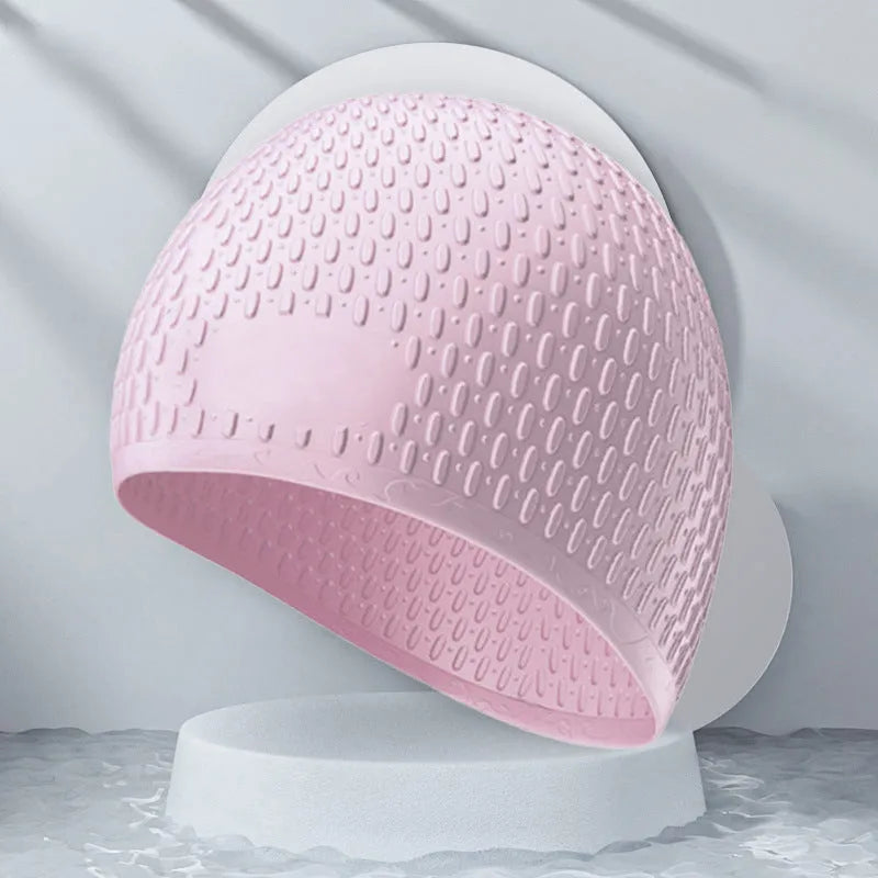 Silicone water drop swimming cap for adults in various solid colours on white background