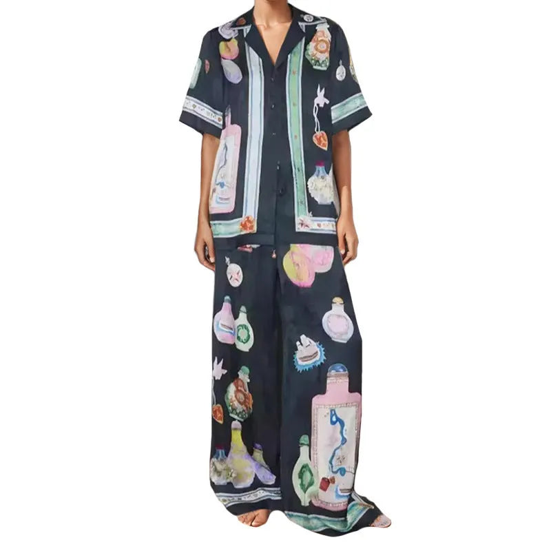 Black women's co-ord set with cartoon animation print, featuring a cardigan and trousers.