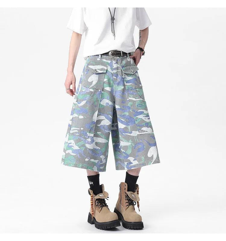 Women's cropped camouflage denim cargo trousers with a pocket on the leg.