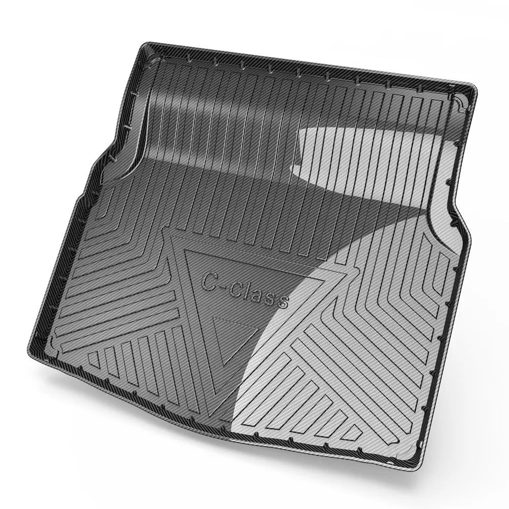 Black TPE car boot liner mat with a carbon fibre pattern texture, laid flat.