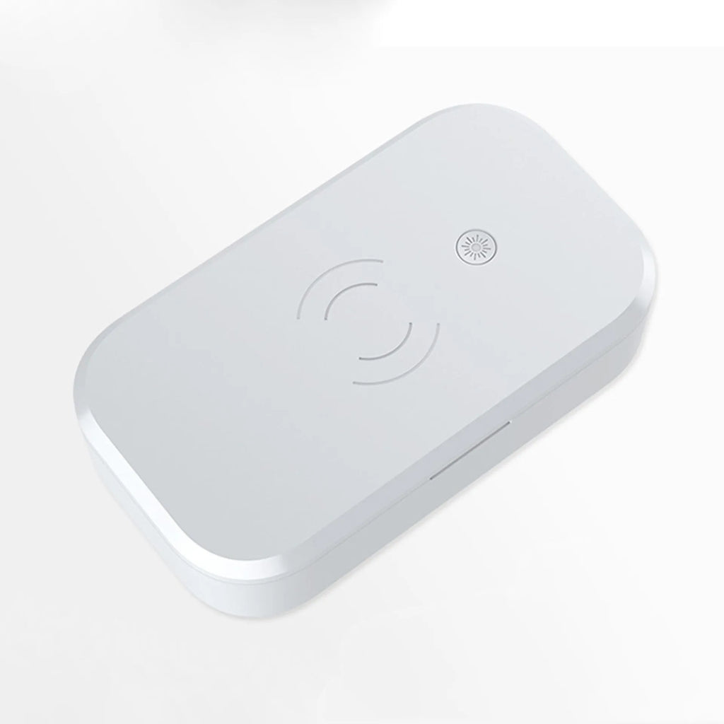 White ultraviolet disinfection box with wireless phone charging pad on top.