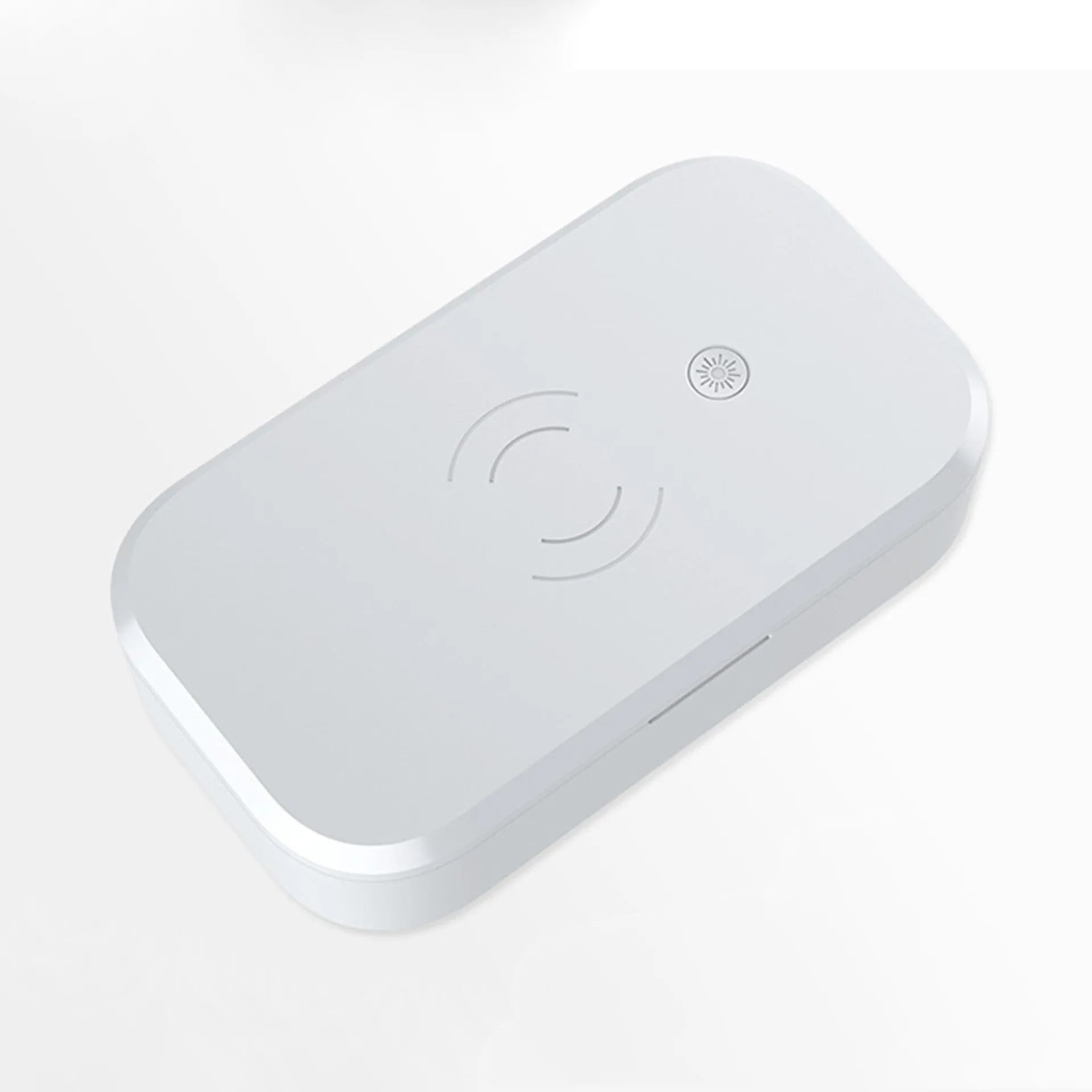 White ultraviolet disinfection box with wireless phone charging pad on top.