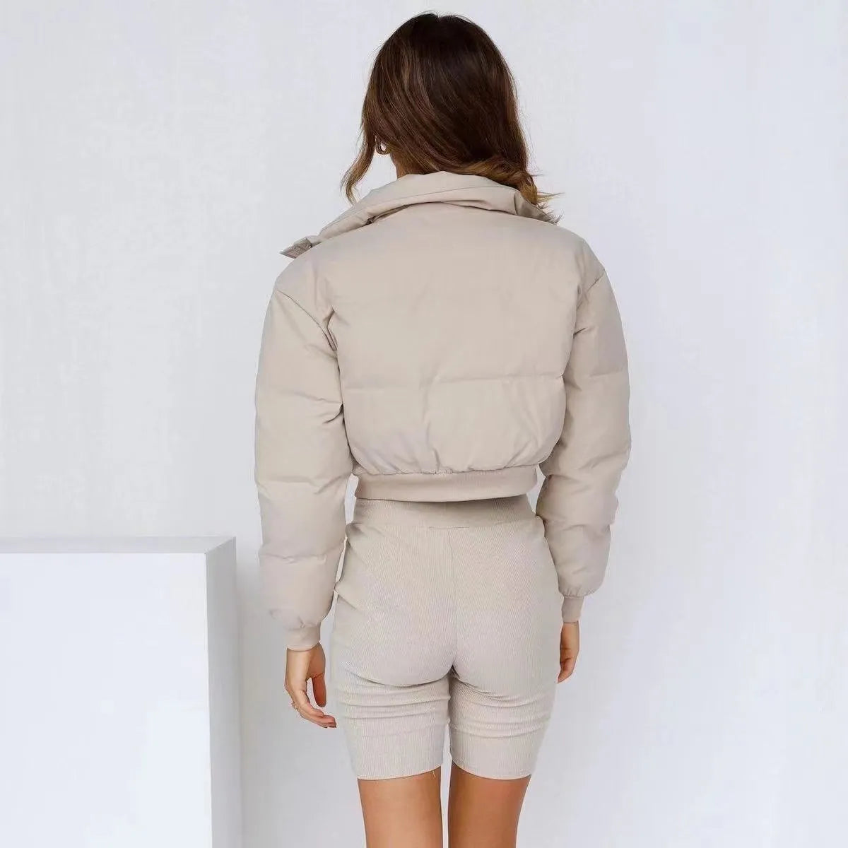 Loose blue polyester jacket for women with long sleeves on hanger