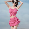 Women's solid colour milk silk bikini swimsuit shown in pitaya red, yellow, and black.