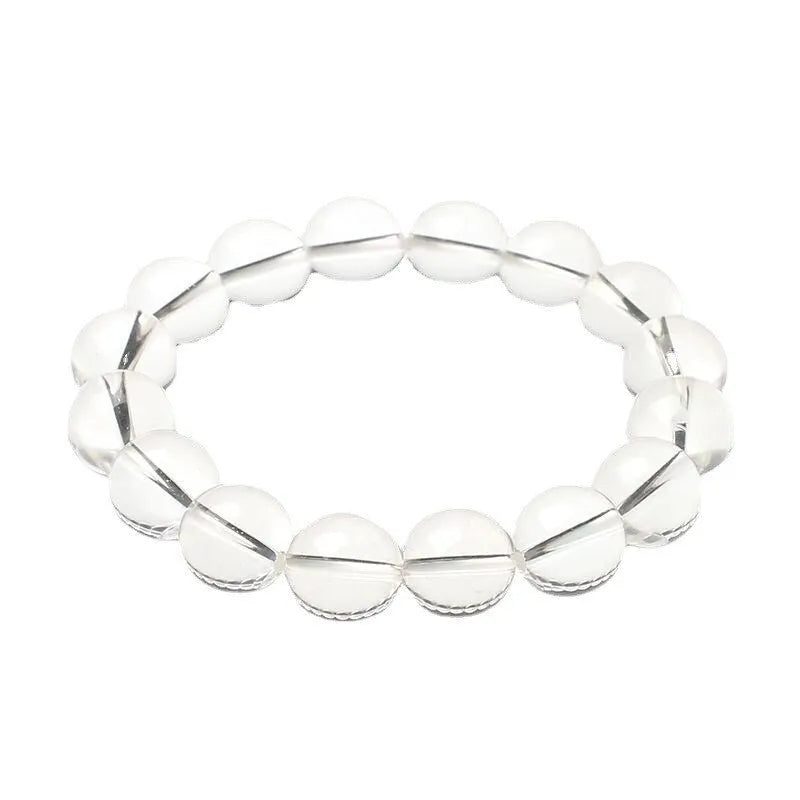 Natural Donghai white crystal round bead geometric bracelet on a wrist.