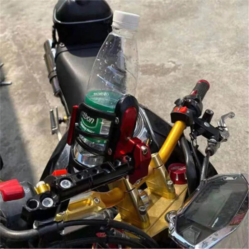 Black water bottle cage mounted on a Honda X-ADV scooter.