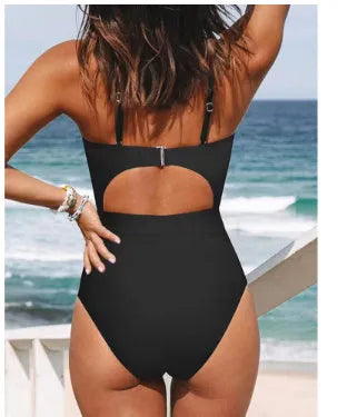Women's backless solid colour one-piece swimsuit on a hanger