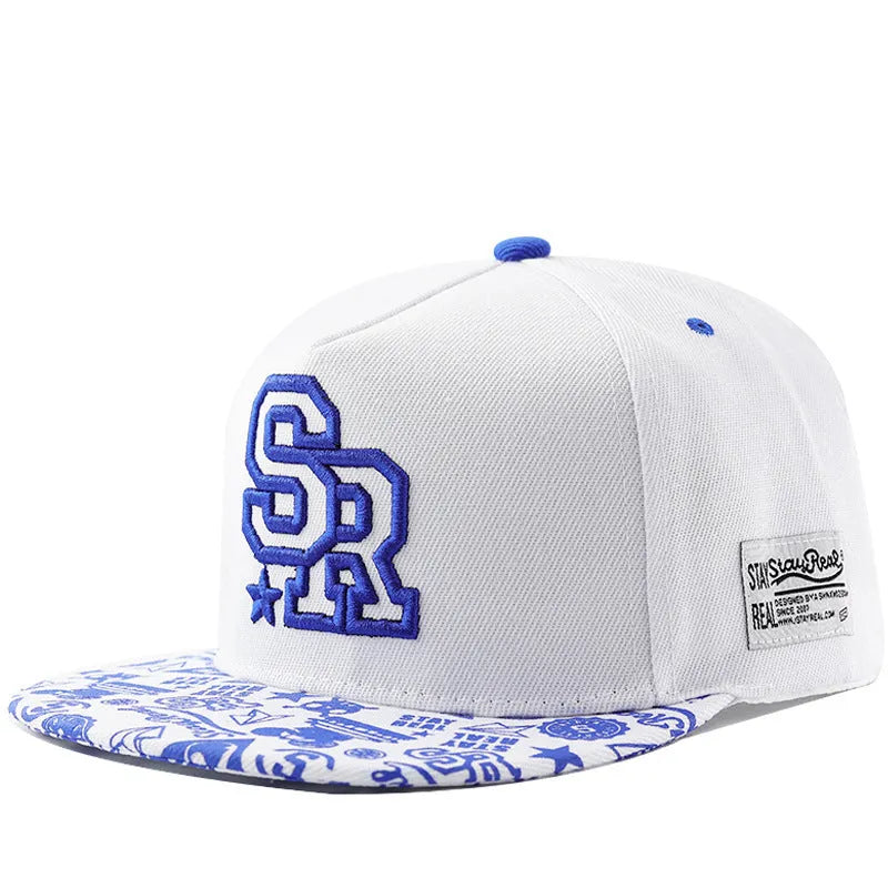 Adjustable black cotton baseball cap with white letter embroidery on the front, showing dome crown shape.