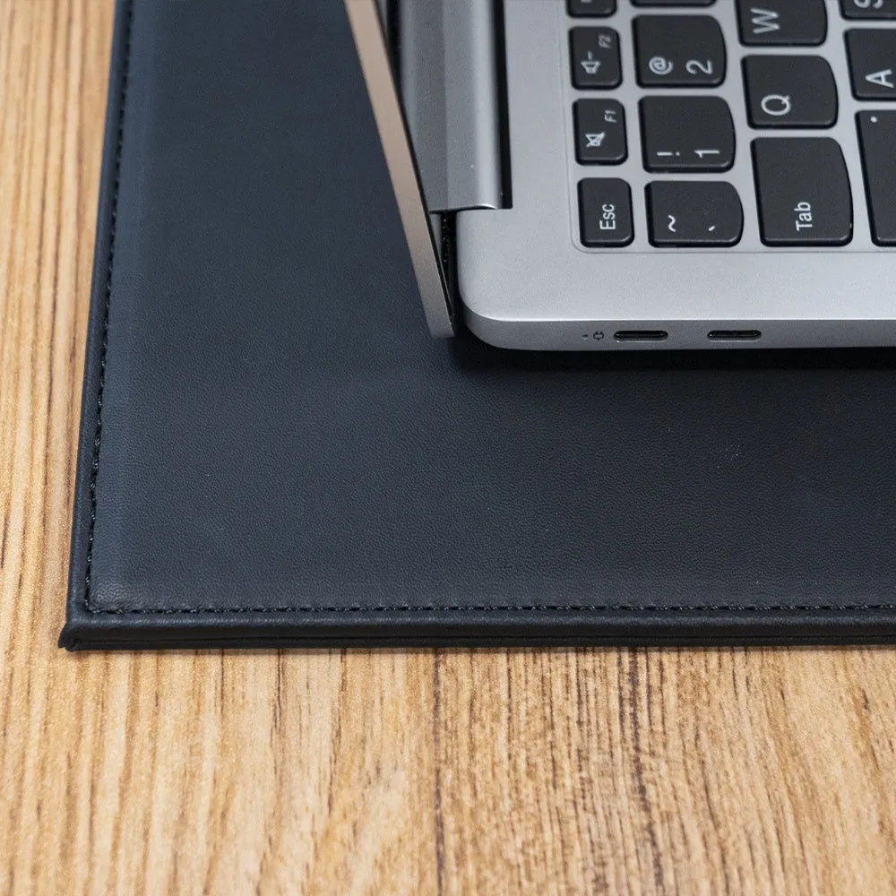 Silicone printing tablet pad in four colours on a desk with a tablet
