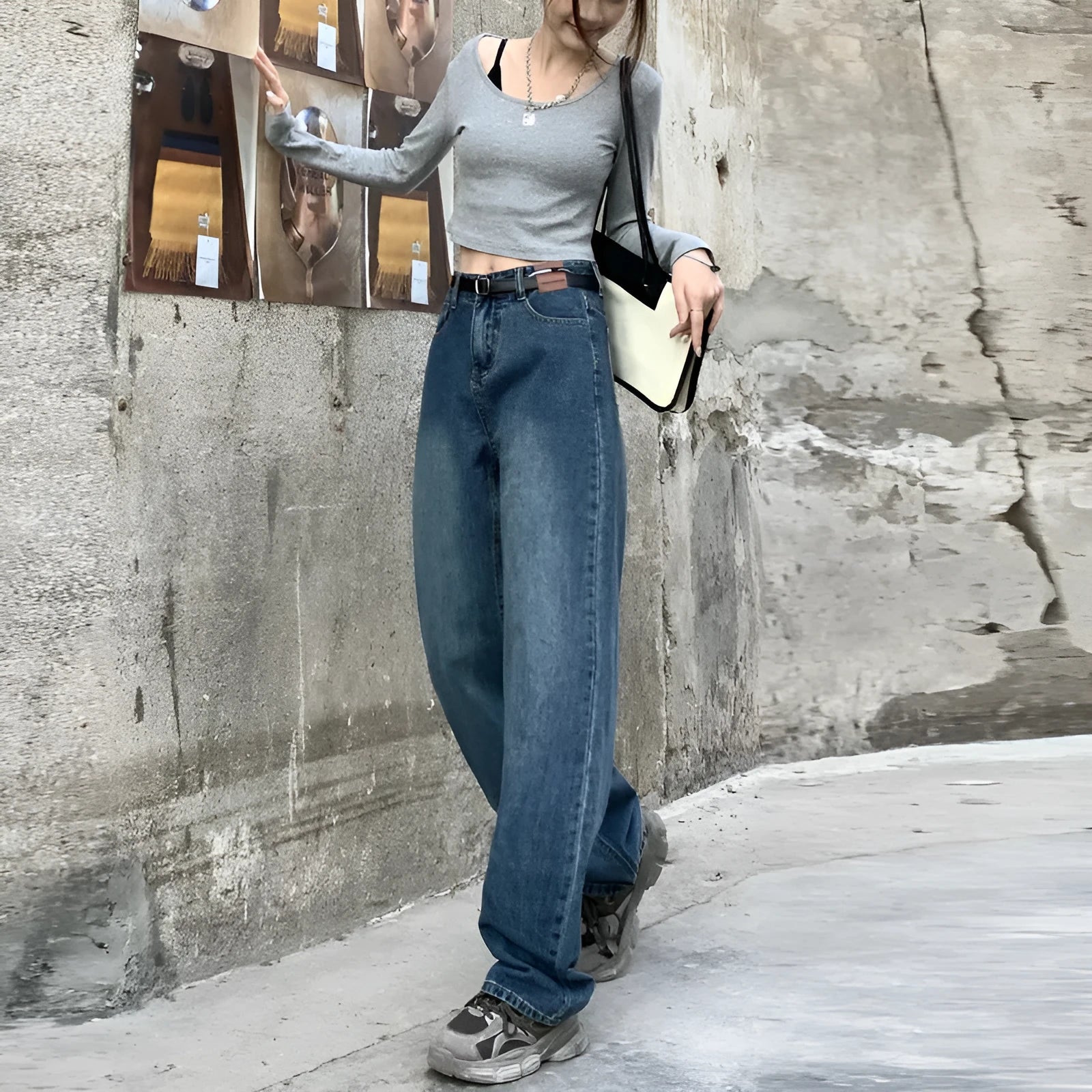 Women's high-waist retro blue straight-leg jeans on a hanger, showing the classic fit.