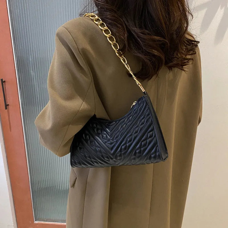 Brown pleated PU chain baguette shoulder bag showing square shape and soft handles.