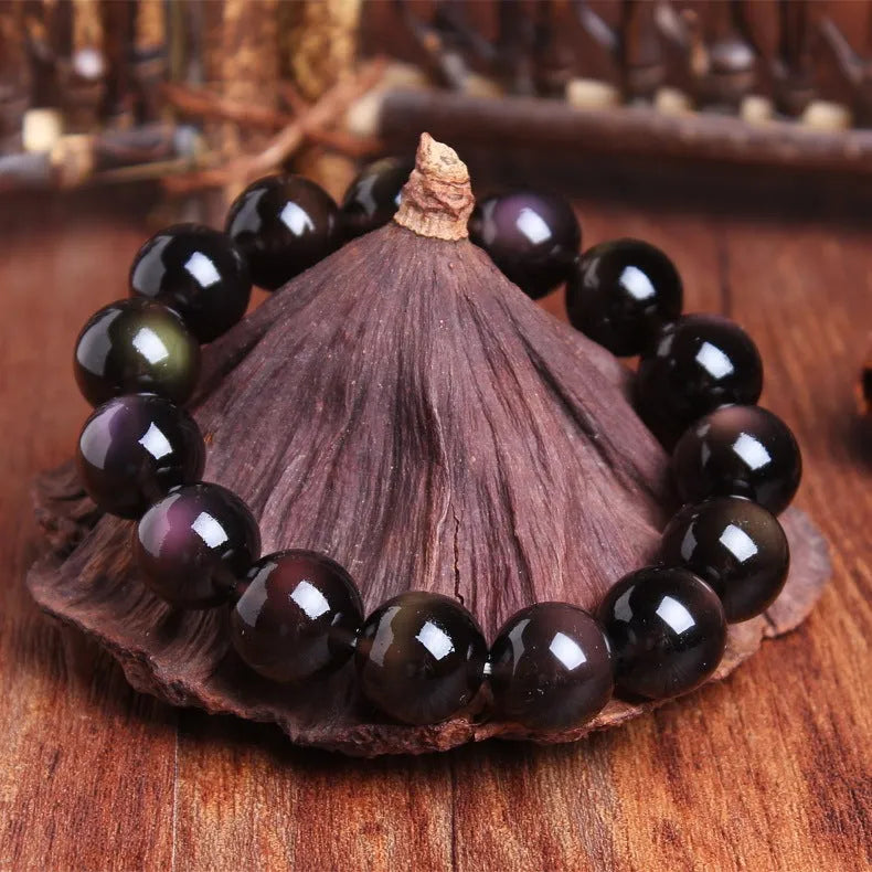 Polished crystal Pi Xiu bracelet with double-eye ice stone colouration in ethnic geometric style