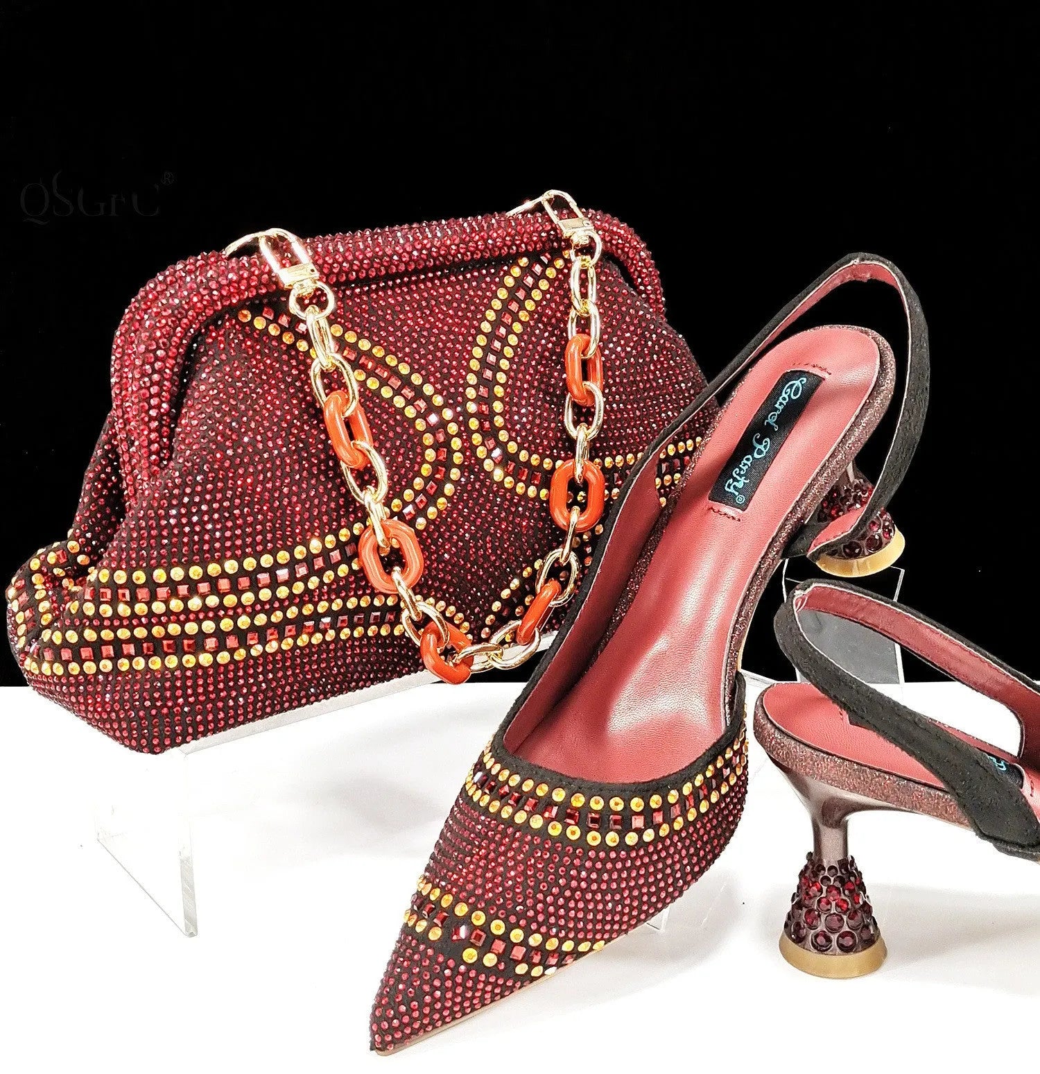 Women's pointed toe high heel shoes with matching small bag in synthetic leather, wine glass heel.
