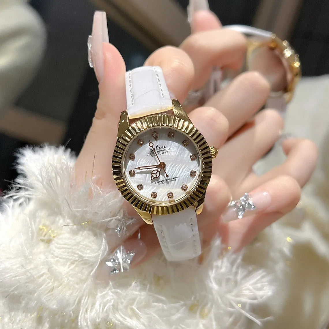 Women's rose shell watch with 7mm thin case, shown with white, red, or black leather strap or steel belt