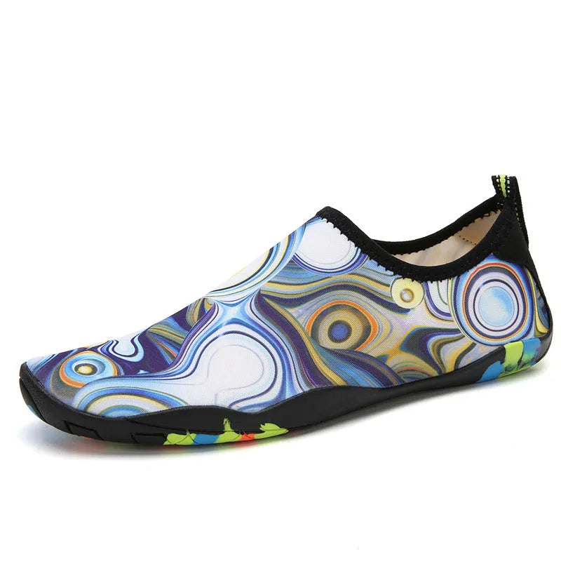 Blue Lycra beach wading shoes with EVA sole for men and women, shown on a sandy background.