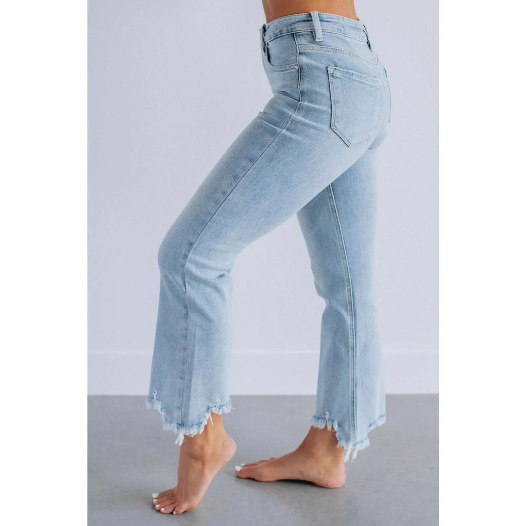 Solid colour women's denim trousers with a hand-worn finish in dark blue and light blue.