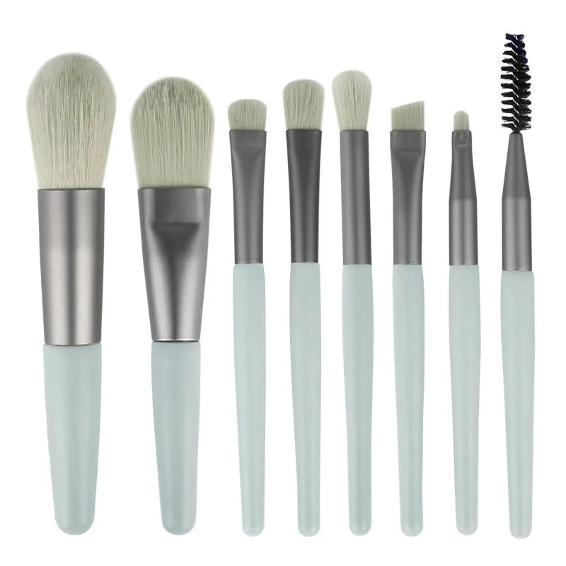 8-piece Morandi makeup brush set with fibre hair bristles in pink, blue, apricot, and green on a light background