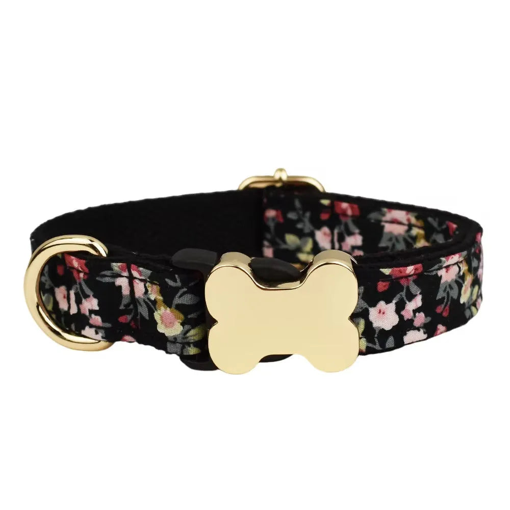 Flat nylon dog collar with printed grid pattern and white bone-shaped plastic buckle on a blue background.
