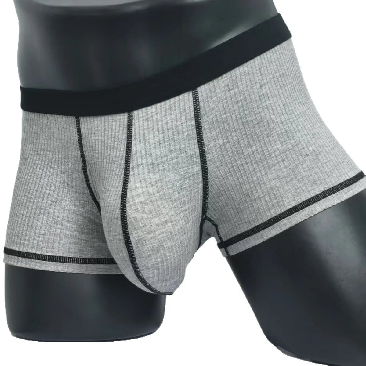 Men's solid colour breathable boxer shorts on a white background showing hip lifting design.