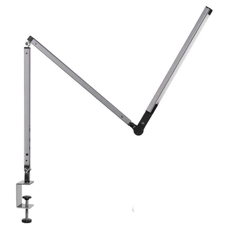 Adjustable LED desk lamp with clip attachment in black finish on wooden desk