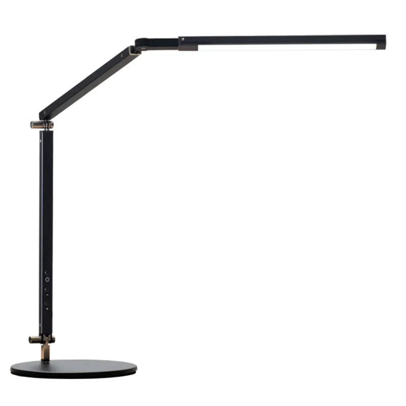 Adjustable LED desk lamp with clip attachment in black finish on wooden desk