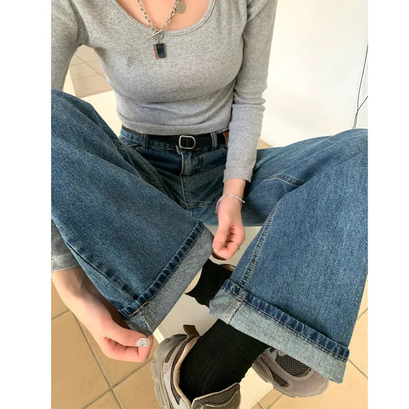 Women's high-waist retro blue straight-leg jeans on a hanger, showing the classic fit.
