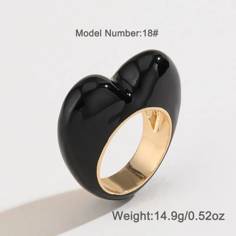 Heart-shaped zinc alloy enamel ring with three-dimensional colour detail in black, pink, purple, or red.