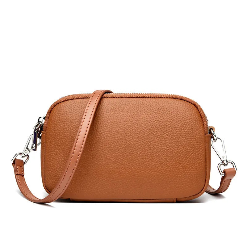 Small square shoulder messenger bag in first layer cowhide with sewing line detail