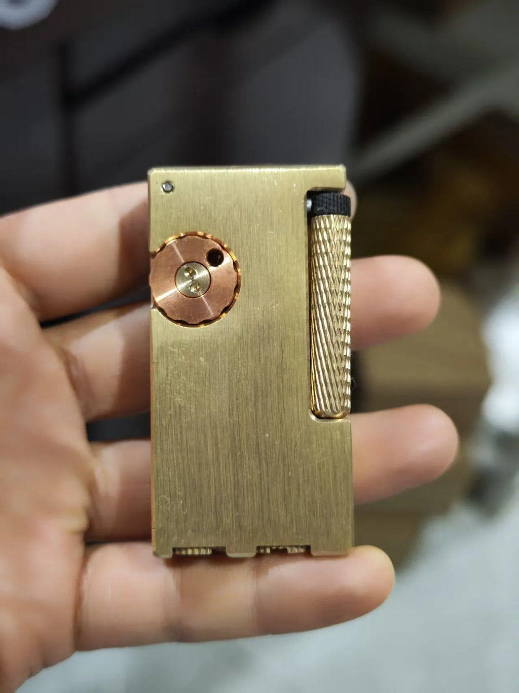 Brass metal lighter with copper flint warehouse and side sliding ignition mechanism