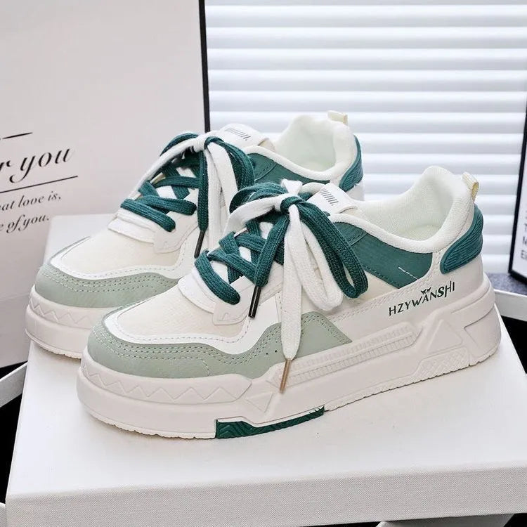 Beige children's board shoes with cross-body straps, thick rubber sole, and front laces on a neutral background.