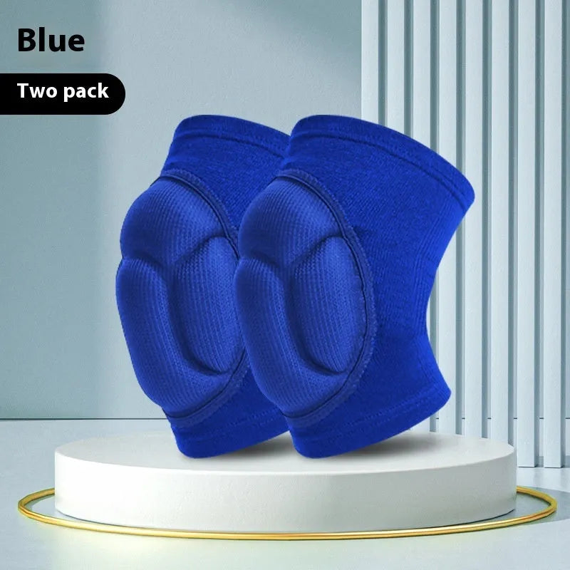 Pair of black thick sponge knee pads for sports protection on a neutral background