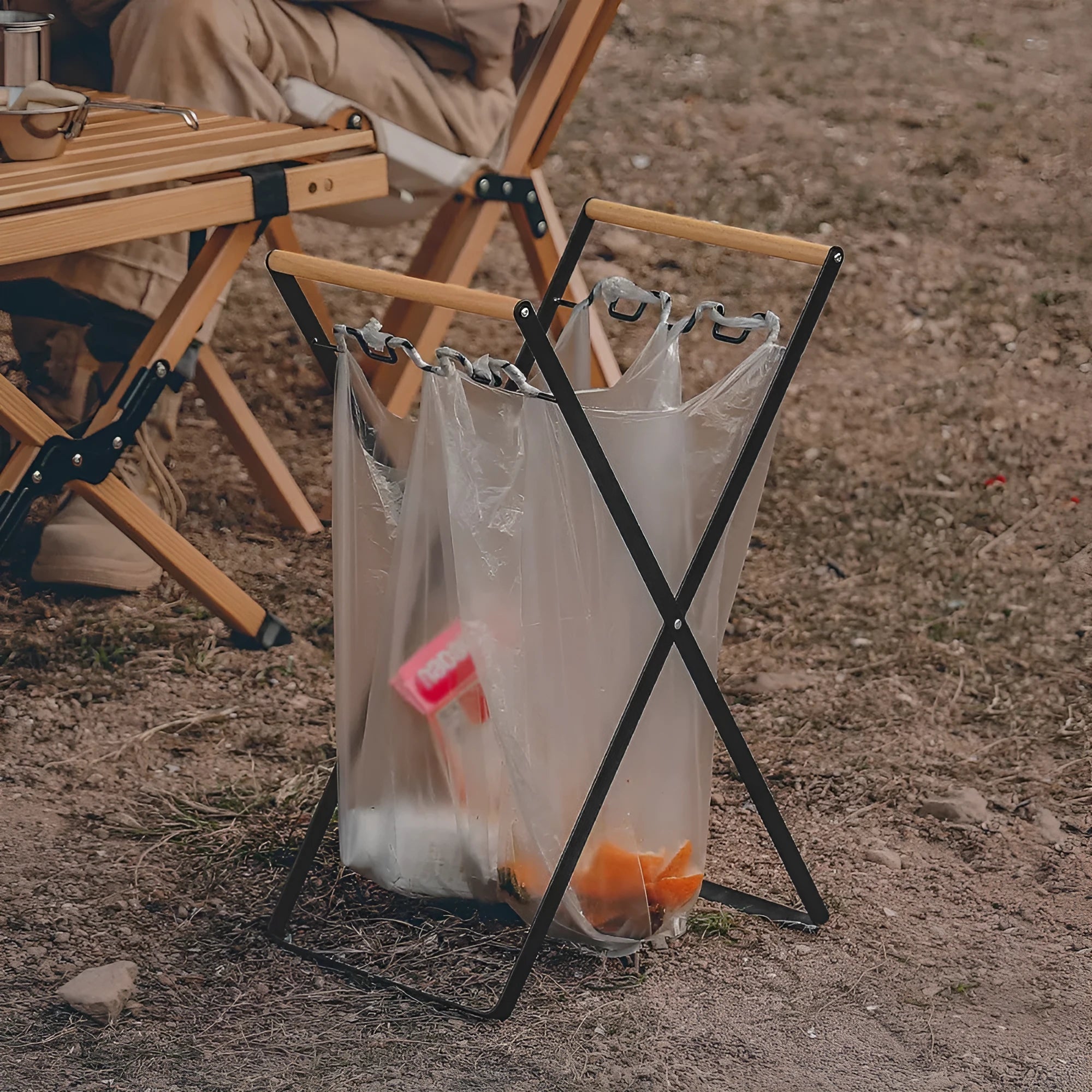 Outdoor iron folding trash rack with wooden handle holding rubbish sack