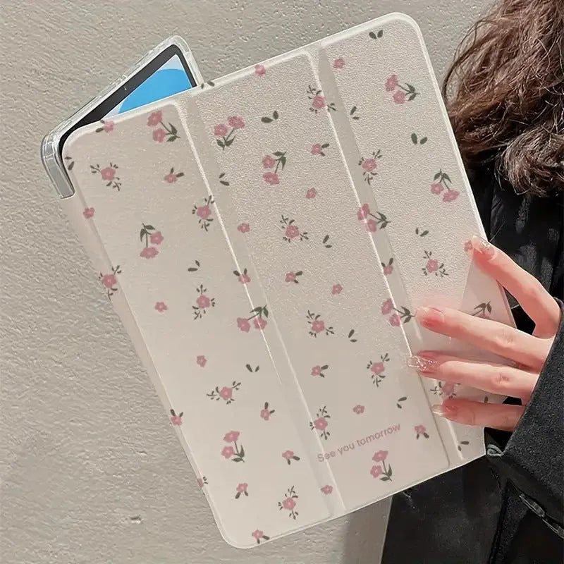 Transparent tri-fold Apple iPad case with cartoon floral print showing magnetic stand function.