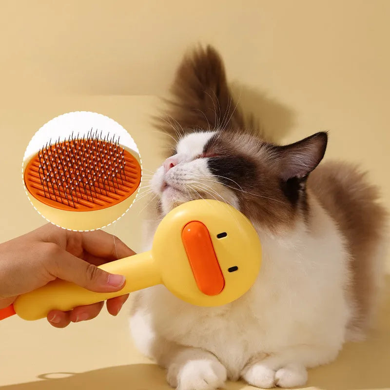 Small yellow duck-shaped pet comb with open needle design for cat and dog grooming