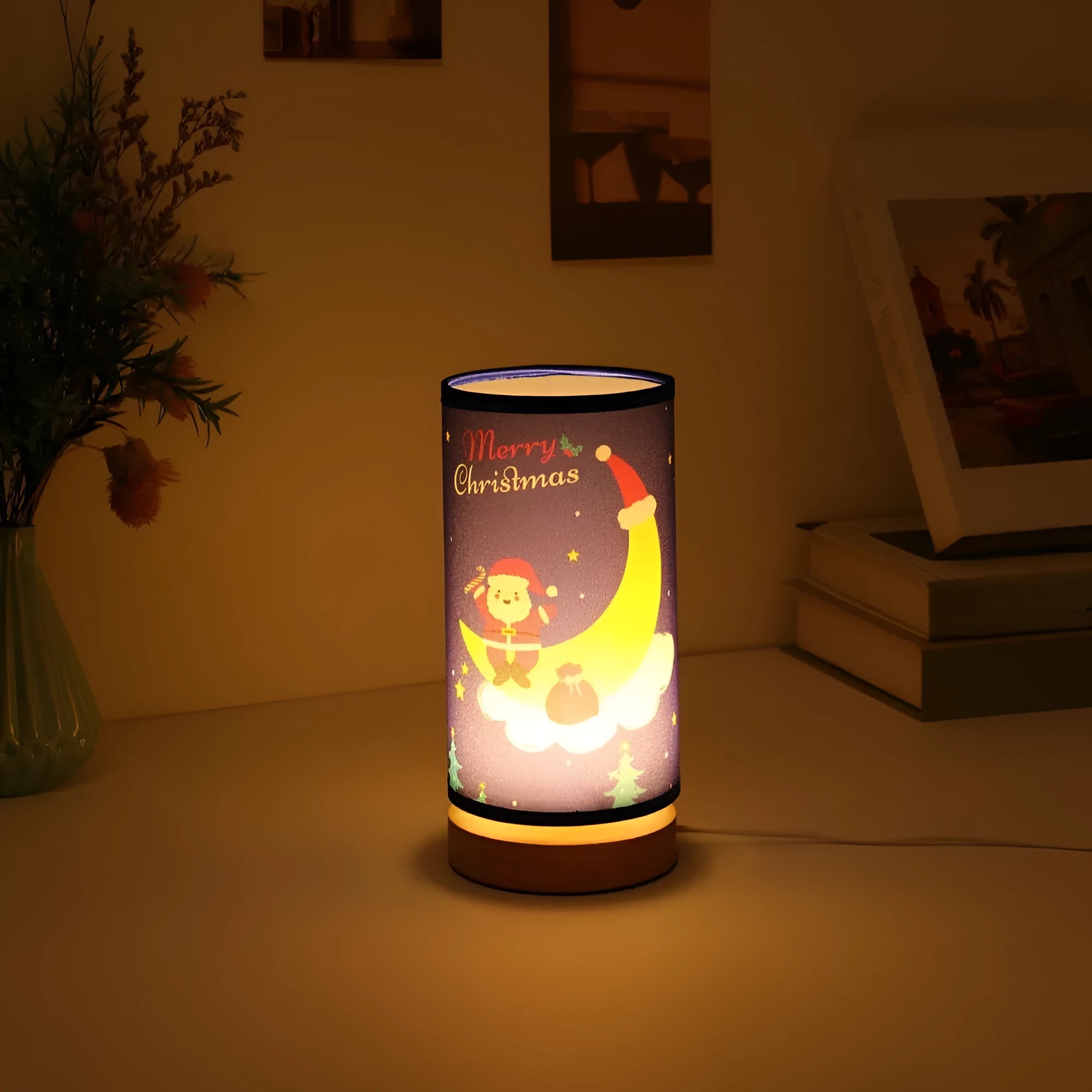 Moon and Santa Claus themed LED night light with a bamboo base and USB plug cable.