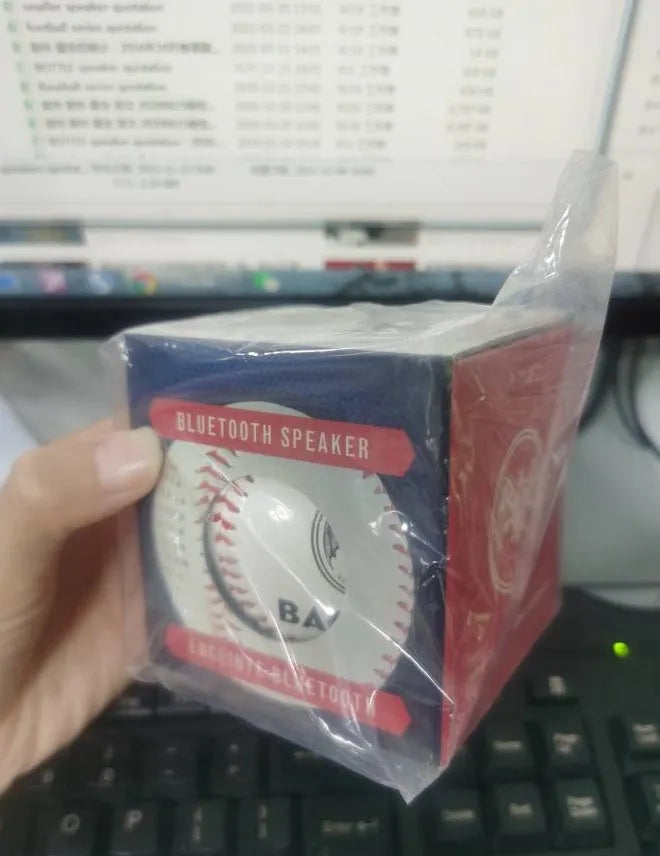 Baseball Home Bluetooth Speaker in white with orange stitching, compact wireless speaker with USB charging port
