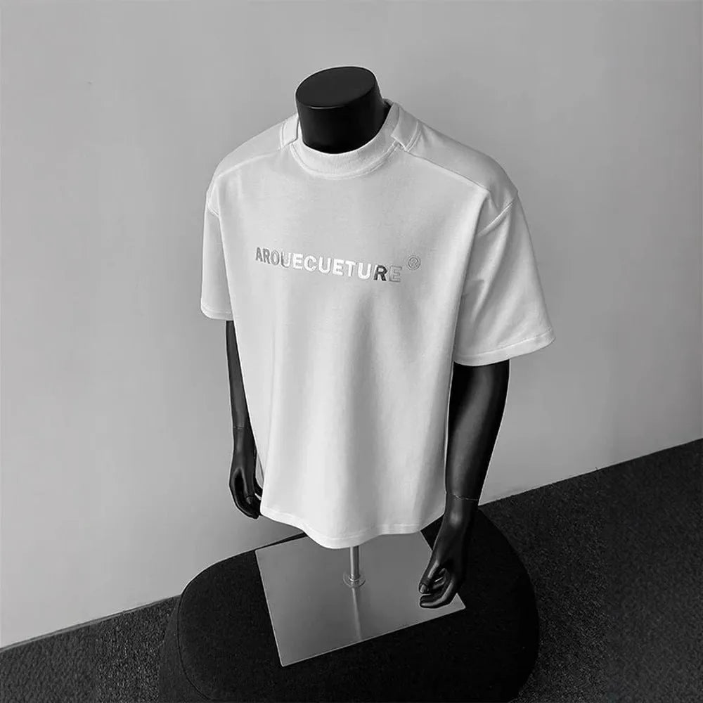 Men's loose short sleeve cotton t-shirt with printed letters in light grey.