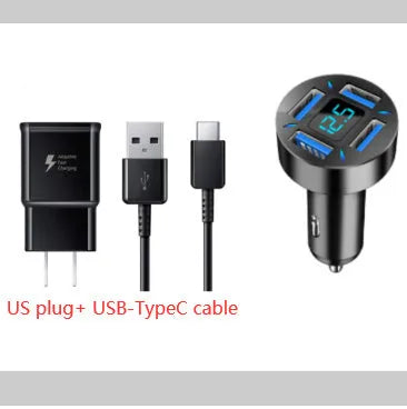 Black four-port USB car charger with LED voltage display plugged into a car socket.